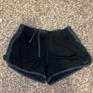 Black Nike athletic shorts with grey trim